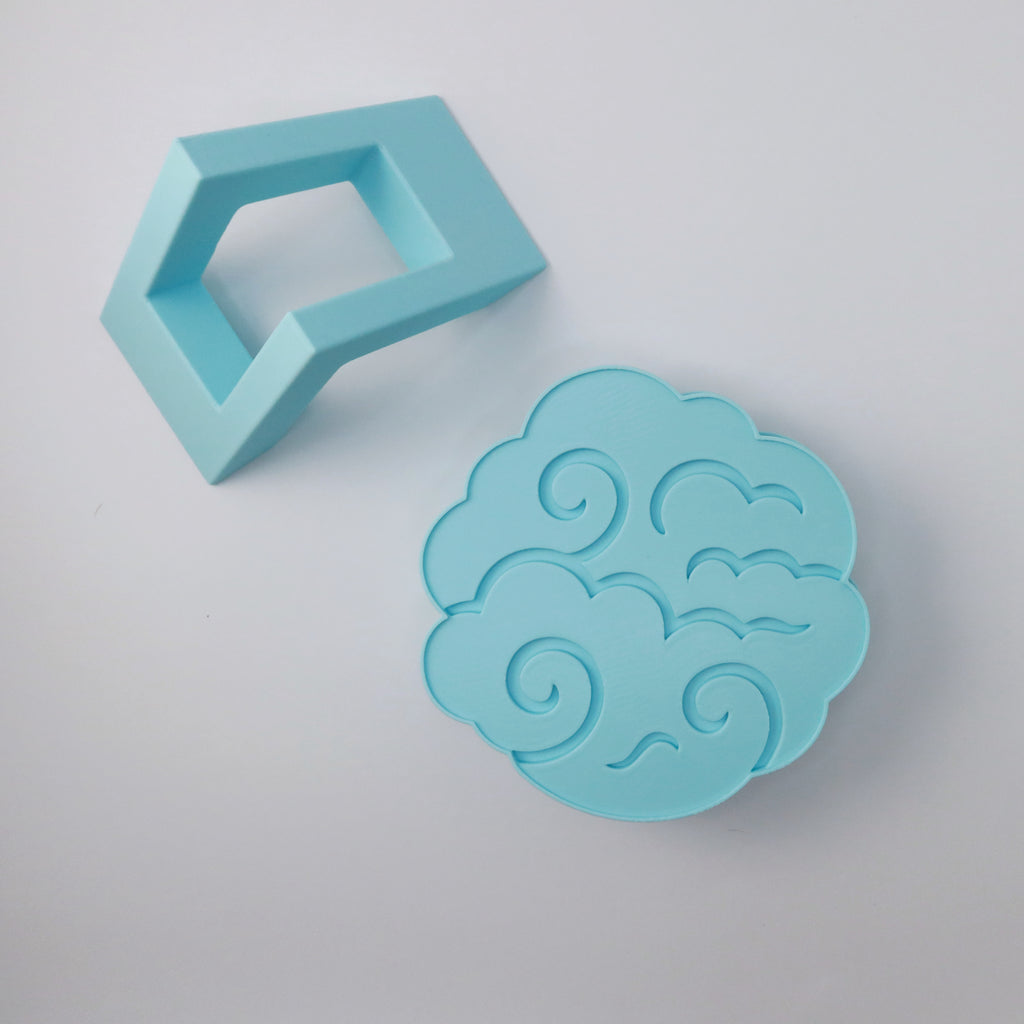 Blue cloud-shaped coasters with a white background