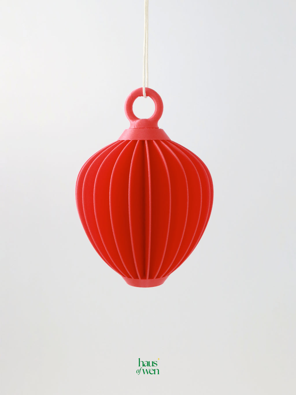 Red lantern ornament on a white background with 'haus of wen' branding.