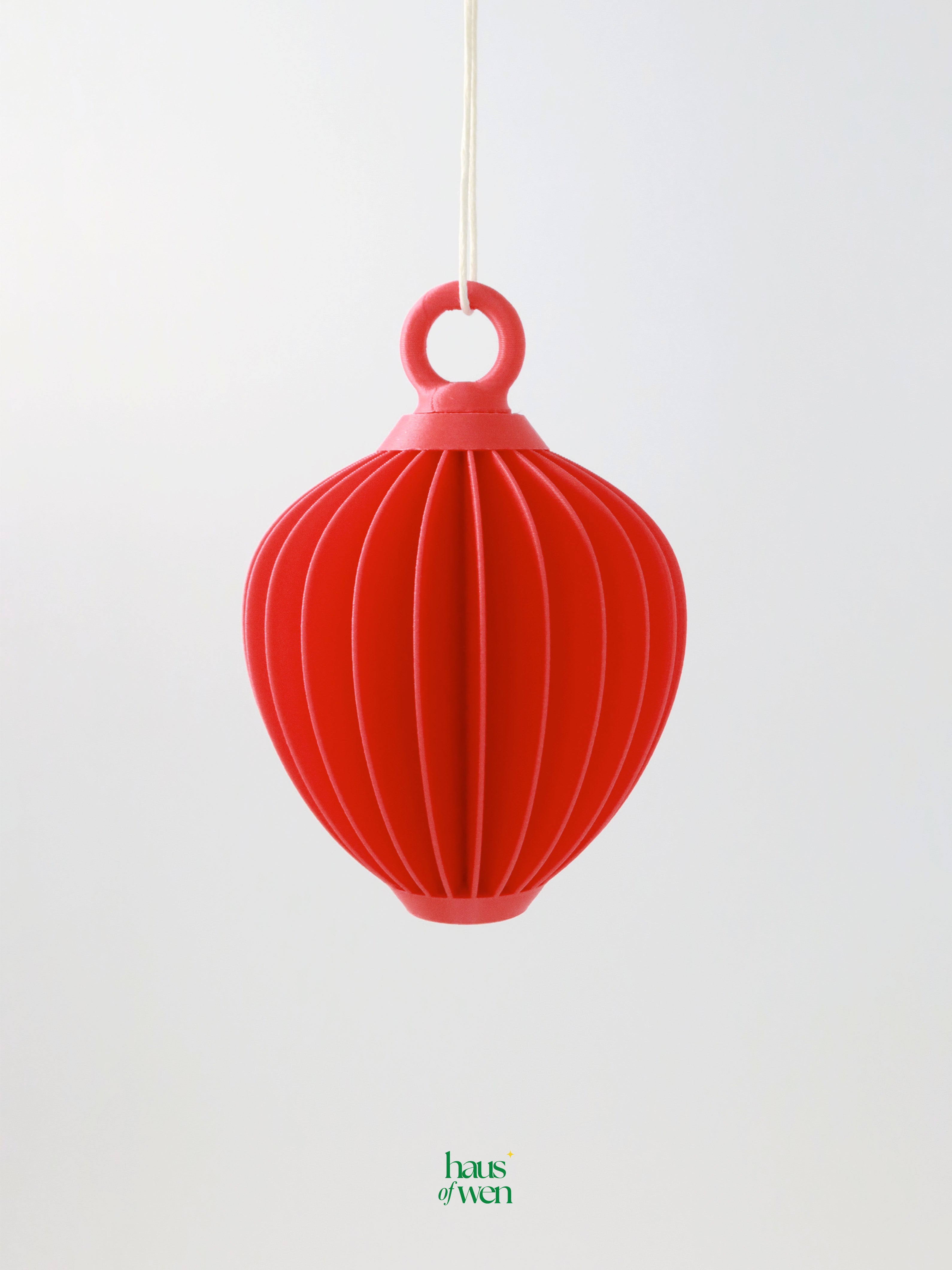 Red lantern ornament on a white background with 'haus of wen' branding.